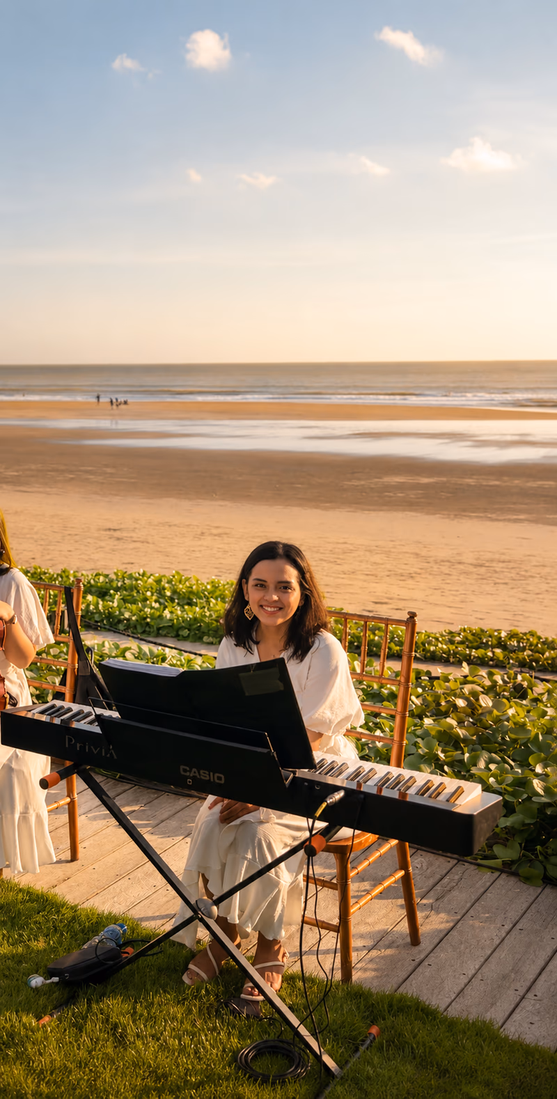 Wedding pianist performing beachfront at sunset in Bali